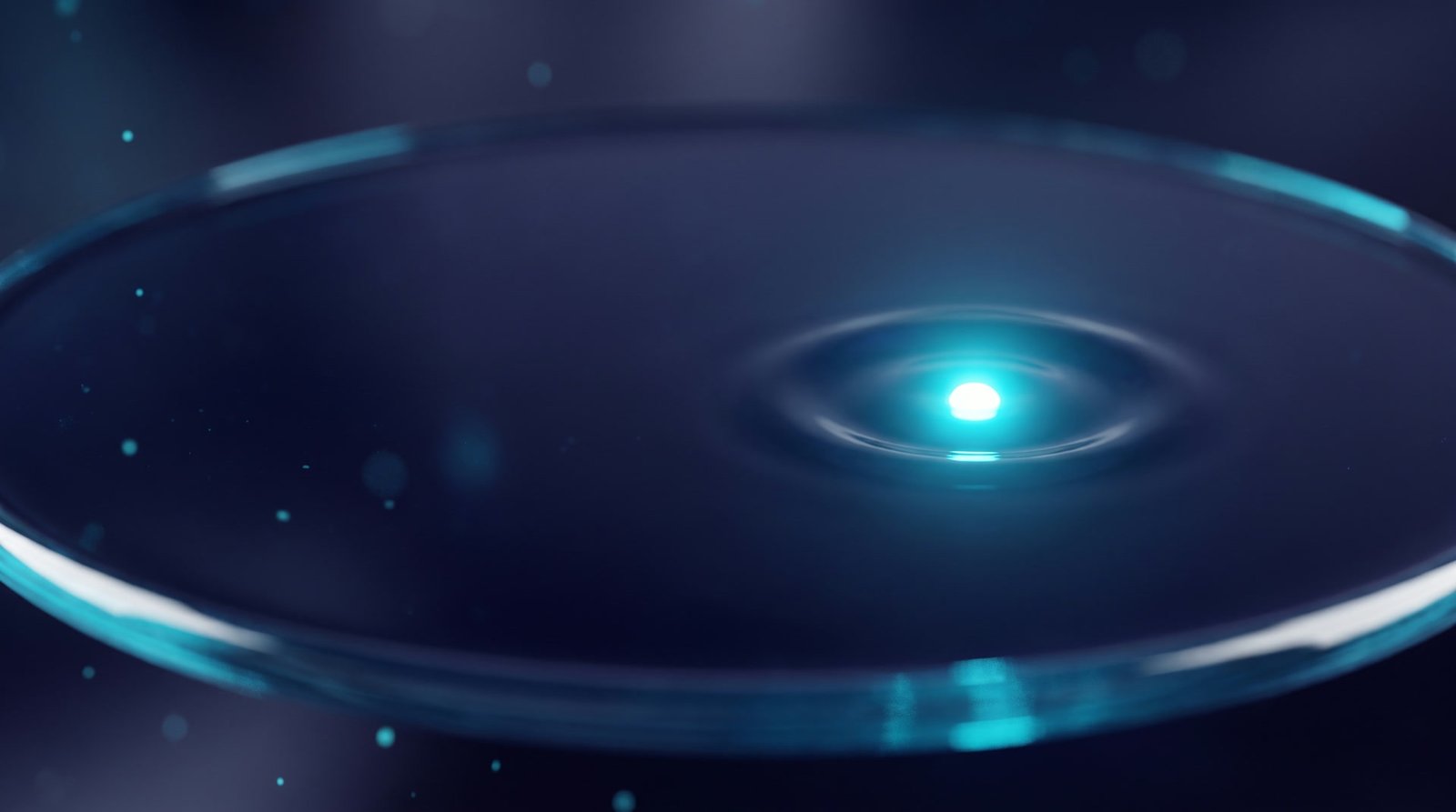 A single point of cyan light on a dark surface, the first message